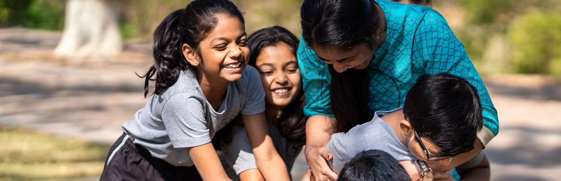 A teacher playing with students.